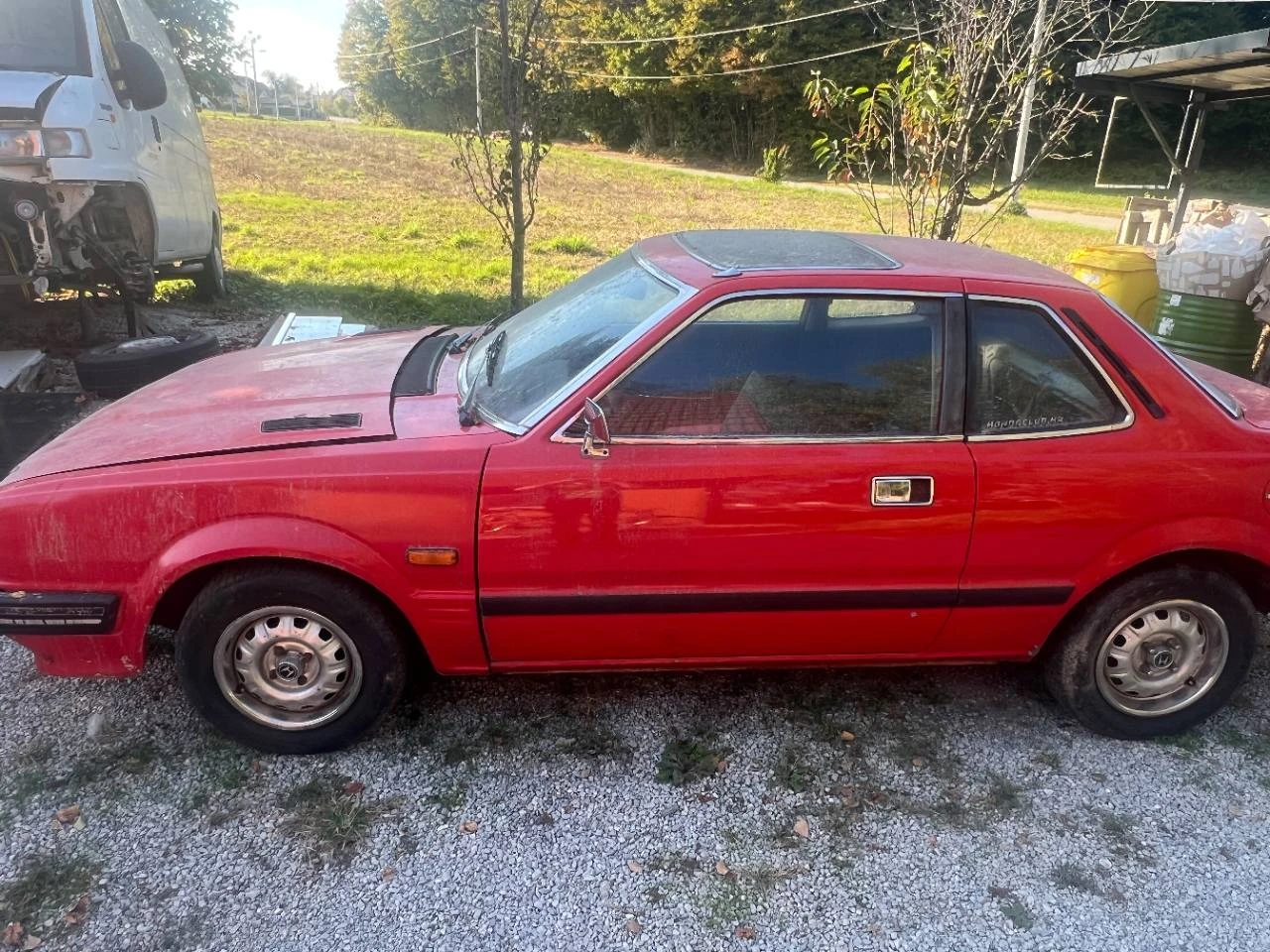 The owner's red Honda Prelude, photographed from the left side